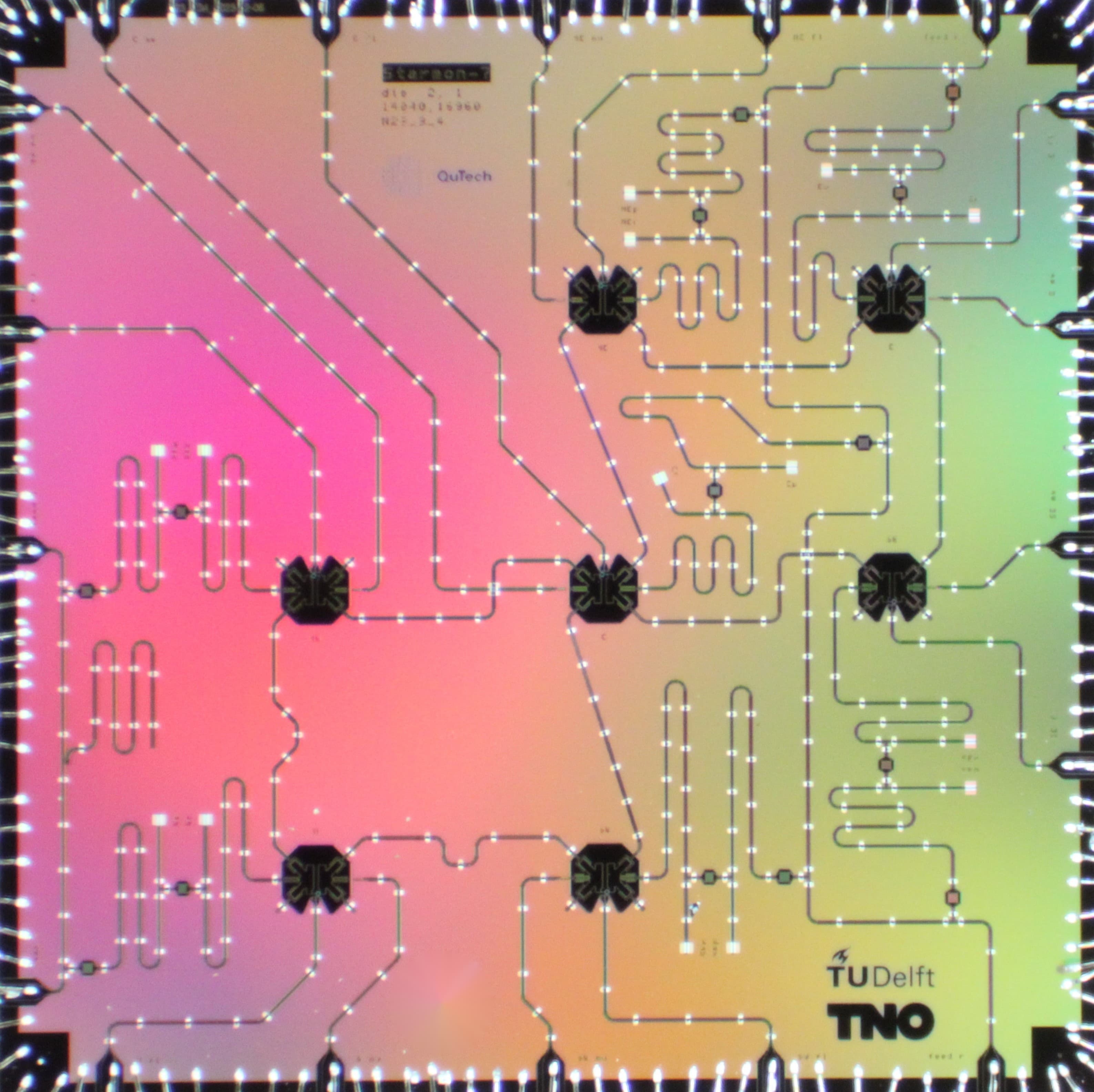 Starmon superconducting quantum processor chip showing transmon qubits as cross-shaped circuits on a sapphire substrate, with microwave drive lines and readout resonators. TU Delft / TNO.